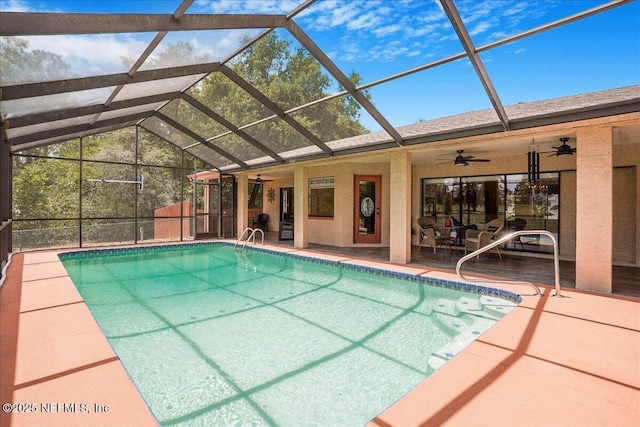 5088 Merrifield Ct, Spring Hill, FL 34608 - outdoor pool with glass enclosure, ceiling fan, and a patio area