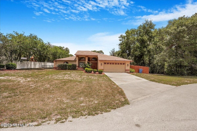 5088 Merrifield Ct, Spring Hill, FL 34608 - view of front facade with a garage, a front lawn, fence, stucco siding, and concrete driveway