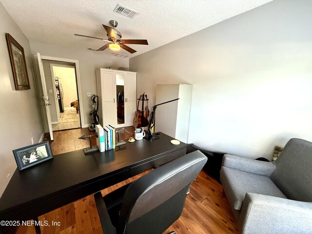 2599 Sandy Hollow Dr, Middleburg, FL 32068 - office with wood finished floors, a ceiling fan, a textured ceiling, and lofted ceiling