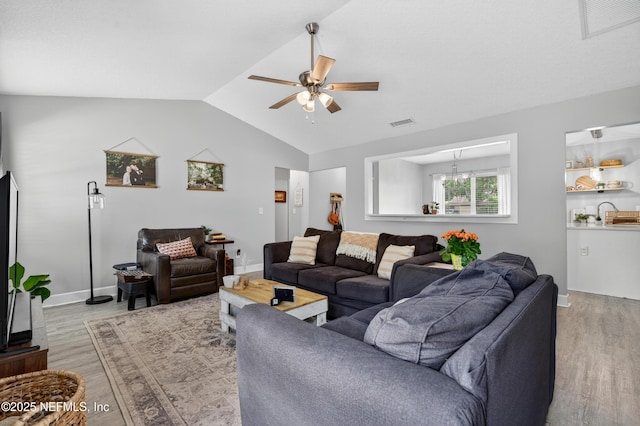 2599 Sandy Hollow Dr, Middleburg, FL 32068 - living room with light wood finished floors, ceiling fan, and lofted ceiling