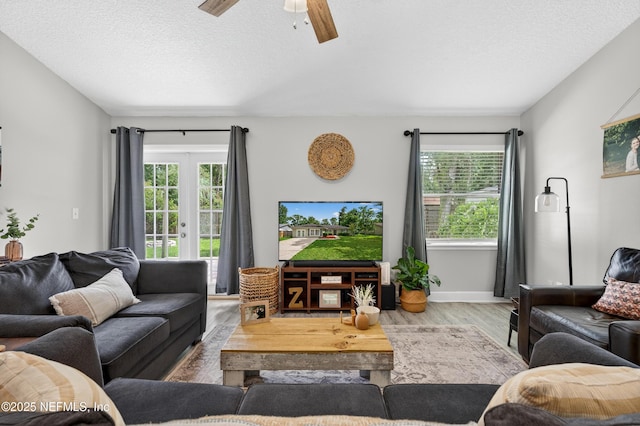 2599 Sandy Hollow Dr, Middleburg, FL 32068 - living room featuring wood finished floors, ceiling fan, and a textured ceiling