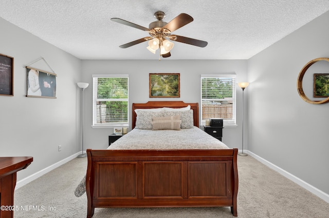 2599 Sandy Hollow Dr, Middleburg, FL 32068 - bedroom featuring light colored carpet, multiple windows, a textured ceiling, and a ceiling fan