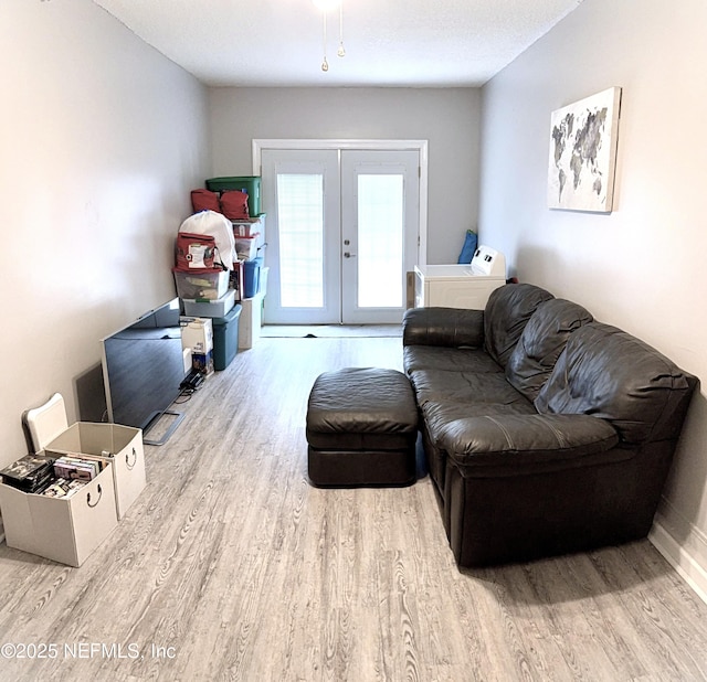 2599 Sandy Hollow Dr, Middleburg, FL 32068 - living room featuring wood finished floors, washer / clothes dryer, and french doors