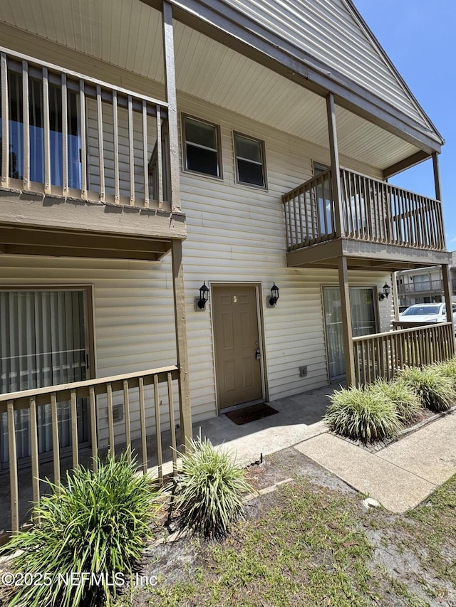 entrance to property with a balcony