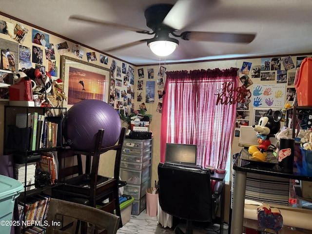 office featuring a ceiling fan, ornamental molding, and marble finish floor