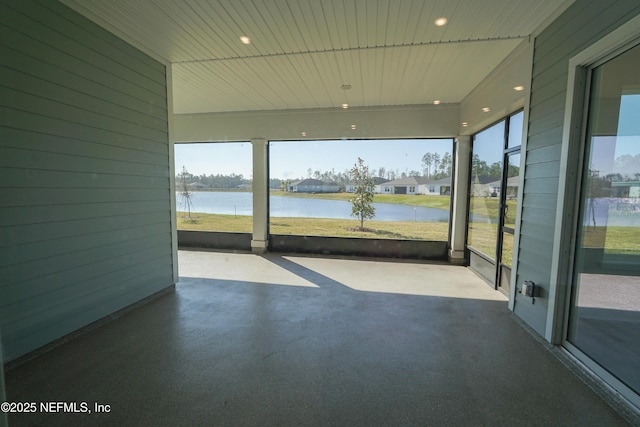 view of patio with a water view