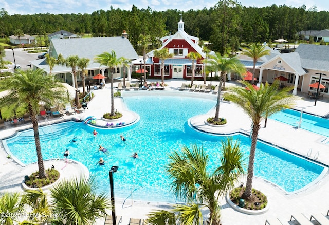 community pool with a patio area