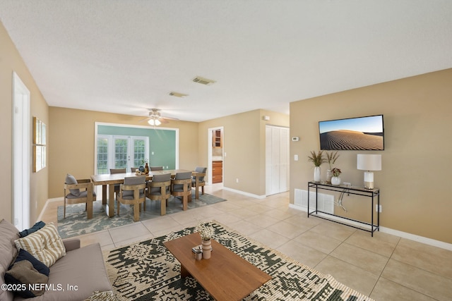 369 Altara Dr, Saint Augustine, FL 32086 - living room with light tile patterned flooring, baseboards, and a ceiling fan