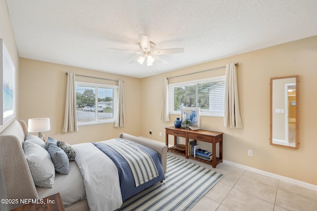 369 Altara Dr, Saint Augustine, FL 32086 - bedroom with multiple windows, light tile patterned floors, baseboards, and ceiling fan