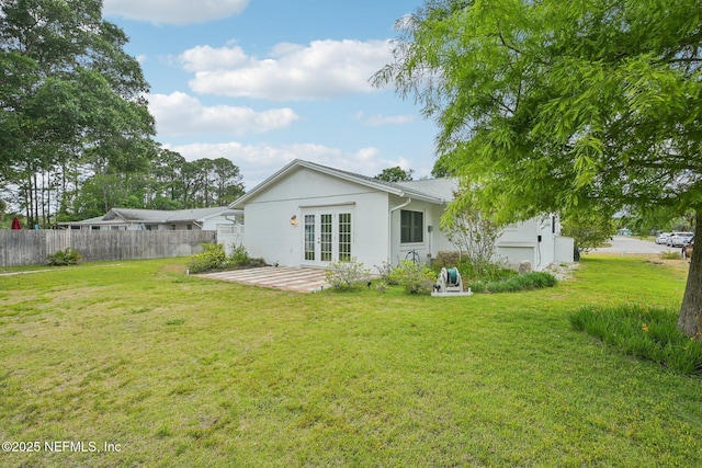 369 Altara Dr, Saint Augustine, FL 32086 - back of house with french doors and an attached garage
