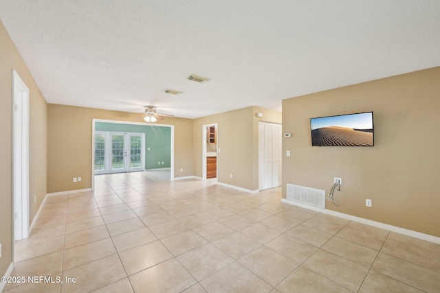 369 Altara Dr, Saint Augustine, FL 32086 - unfurnished living room with light tile patterned flooring, a ceiling fan, and baseboards