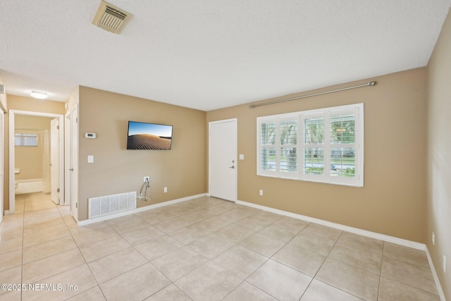 369 Altara Dr, Saint Augustine, FL 32086 - empty room with light tile patterned floors and baseboards