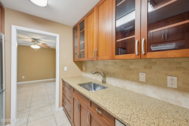 369 Altara Dr, Saint Augustine, FL 32086 - kitchen with a sink, light tile patterned flooring, baseboards, and brown cabinets