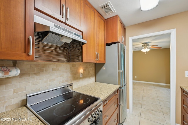 369 Altara Dr, Saint Augustine, FL 32086 - kitchen featuring range with electric stovetop, freestanding refrigerator, a ceiling fan, light tile patterned floors, and decorative backsplash