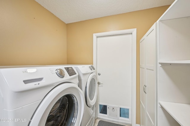 369 Altara Dr, Saint Augustine, FL 32086 - washroom with washing machine and clothes dryer and a textured ceiling