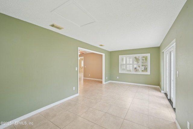 369 Altara Dr, Saint Augustine, FL 32086 - spare room with light tile patterned flooring and baseboards