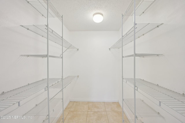 369 Altara Dr, Saint Augustine, FL 32086 - walk in closet with tile patterned flooring