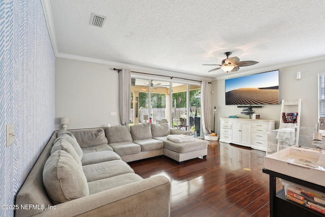 3367 Turkey Creek Dr, Green Cove Springs, FL 32043 - living room with a ceiling fan, a textured ceiling, dark wood-style floors, crown molding, and wallpapered walls