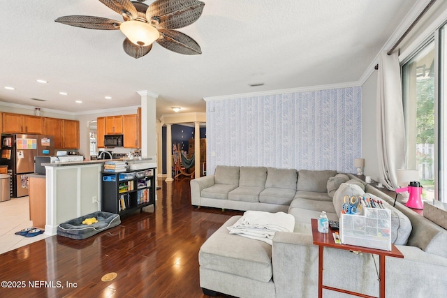 3367 Turkey Creek Dr, Green Cove Springs, FL 32043 - living room with ornamental molding, a ceiling fan, light wood-style flooring, ornate columns, and recessed lighting