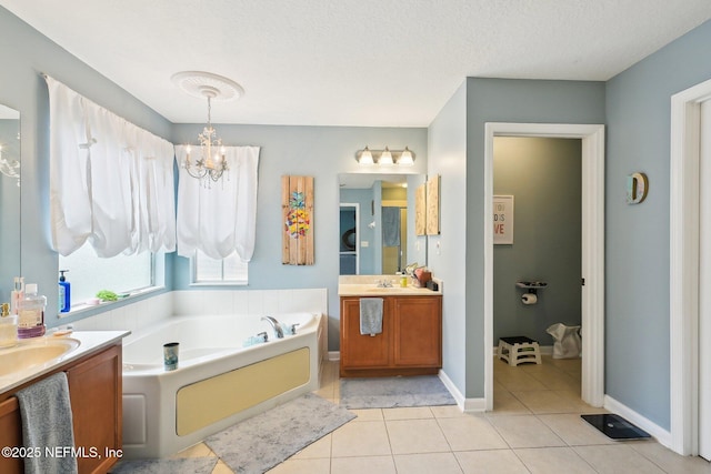 3367 Turkey Creek Dr, Green Cove Springs, FL 32043 - full bath featuring vanity, a garden tub, tile patterned floors, a chandelier, and baseboards