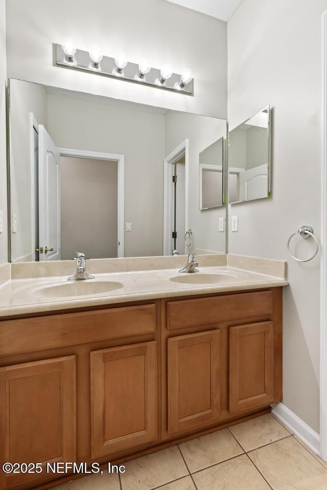 full bath with tile patterned flooring and double vanity