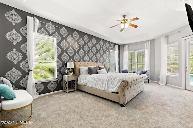 bedroom featuring baseboards, wallpapered walls, access to outside, carpet, and ceiling fan