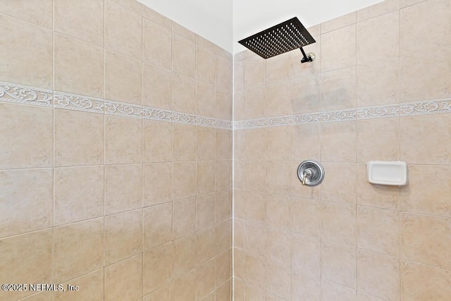 bathroom with a tile shower