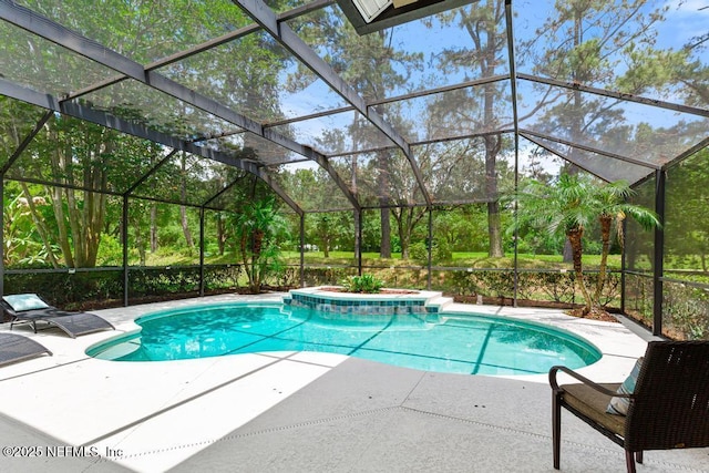 outdoor pool featuring a patio area and glass enclosure