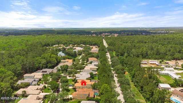 aerial perspective of suburban area featuring a forest