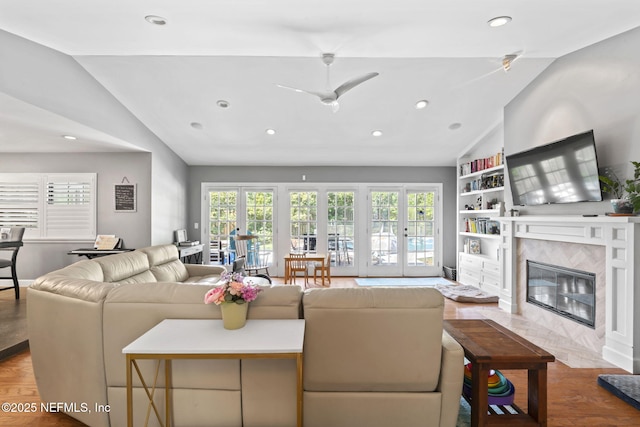 11136 River Creek Dr W, Jacksonville, FL 32223 - living room featuring vaulted ceiling, healthy amount of natural light, recessed lighting, a high end fireplace, and wood finished floors