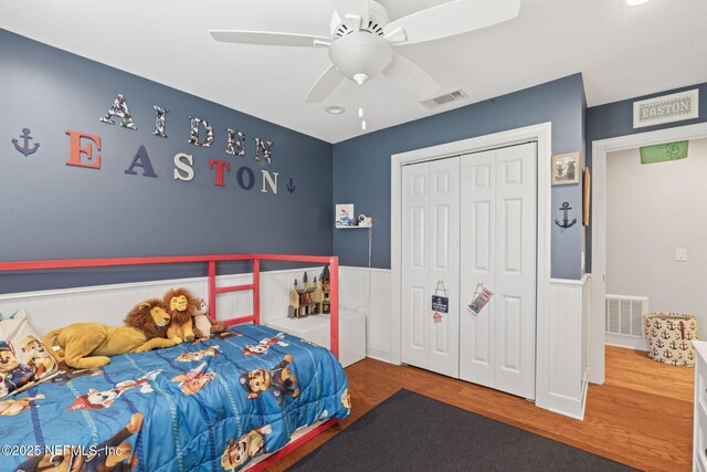 11136 River Creek Dr W, Jacksonville, FL 32223 - bedroom featuring wood finished floors, a closet, ceiling fan, a wainscoted wall, and recessed lighting