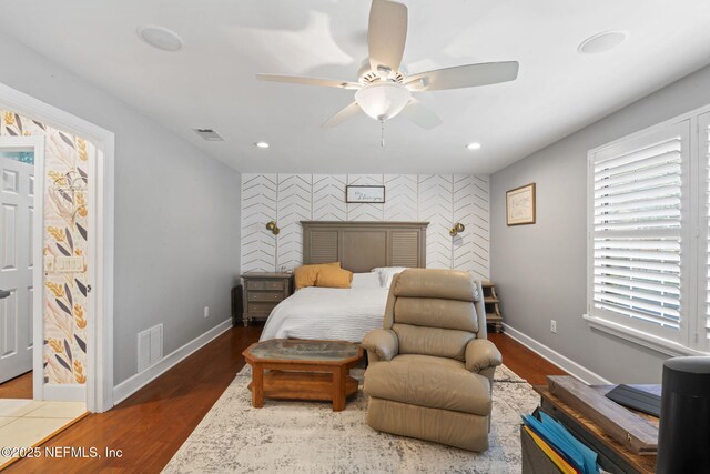 11136 River Creek Dr W, Jacksonville, FL 32223 - bedroom with an accent wall, baseboards, wood finished floors, recessed lighting, and ceiling fan