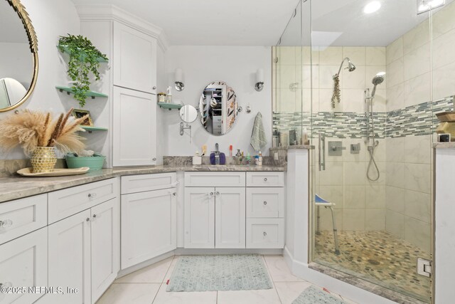 11136 River Creek Dr W, Jacksonville, FL 32223 - bathroom with a stall shower, tile patterned floors, and vanity