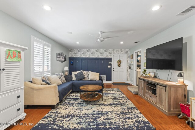 11136 River Creek Dr W, Jacksonville, FL 32223 - living room with wood finished floors, ceiling fan, an accent wall, and recessed lighting