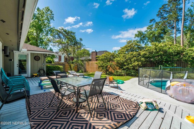11136 River Creek Dr W, Jacksonville, FL 32223 - wooden terrace featuring a fenced backyard and outdoor dining area