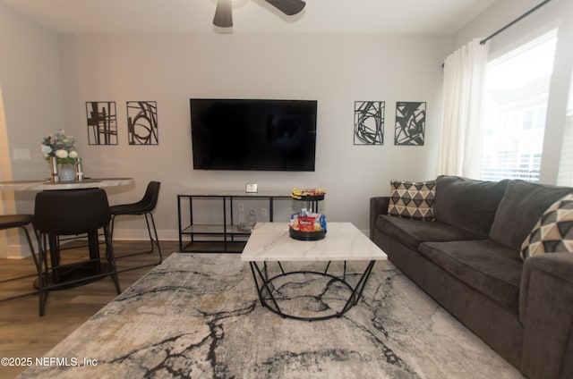 11104 Motion Ct, Jacksonville, FL 32256 - living room with baseboards, ceiling fan, and wood finished floors
