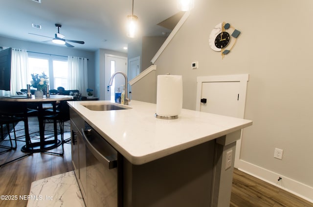 11104 Motion Ct, Jacksonville, FL 32256 - kitchen featuring visible vents, a kitchen island with sink, ceiling fan, a sink, and dishwasher