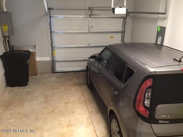 11104 Motion Ct, Jacksonville, FL 32256 - garage with a garage door opener, washer / clothes dryer, and electric panel