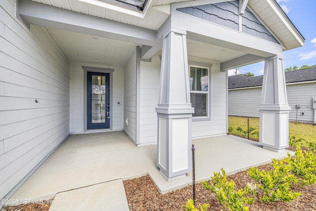 property entrance with covered porch