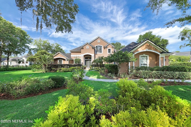 521 S Bridge Creek Dr, Saint Johns, FL 32259 - view of front of home with stucco siding and a front lawn