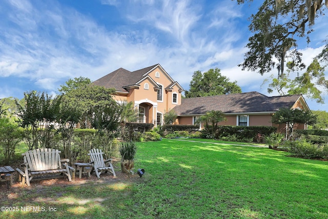 521 S Bridge Creek Dr, Saint Johns, FL 32259 - traditional home featuring stucco siding and a front lawn