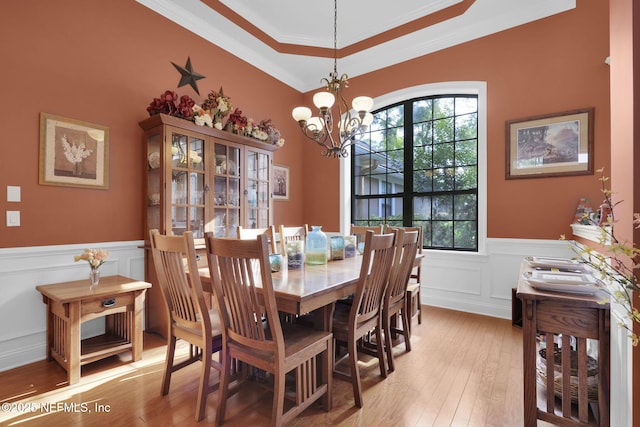 521 S Bridge Creek Dr, Saint Johns, FL 32259 - dining room with a chandelier, a wainscoted wall, ornamental molding, light wood finished floors, and a decorative wall