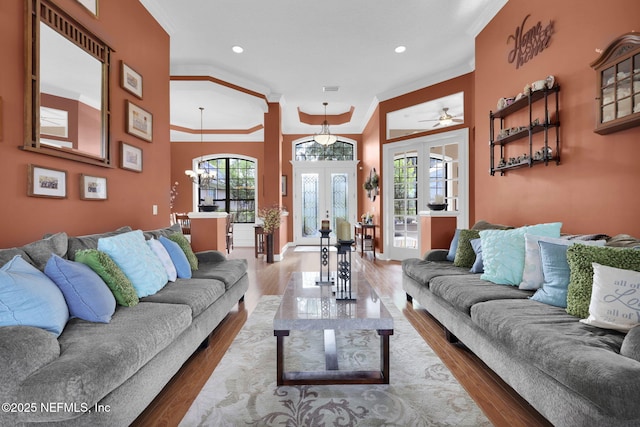 521 S Bridge Creek Dr, Saint Johns, FL 32259 - living room with french doors, ornamental molding, wood finished floors, a chandelier, and recessed lighting