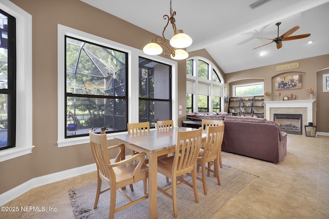 521 S Bridge Creek Dr, Saint Johns, FL 32259 - dining space with vaulted ceiling, a fireplace, ceiling fan, baseboards, and light tile patterned flooring