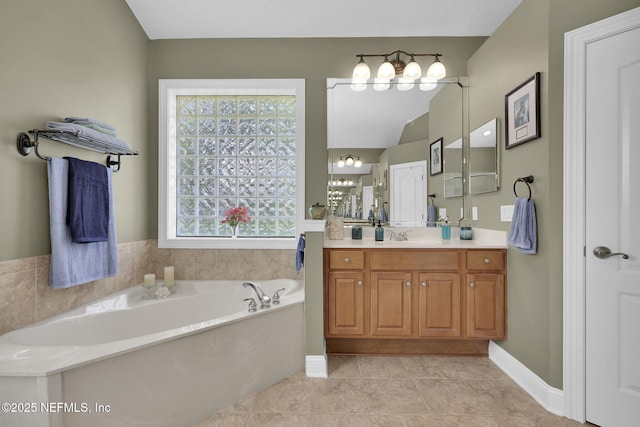 521 S Bridge Creek Dr, Saint Johns, FL 32259 - bathroom with a garden tub, vanity, tile patterned floors, and baseboards
