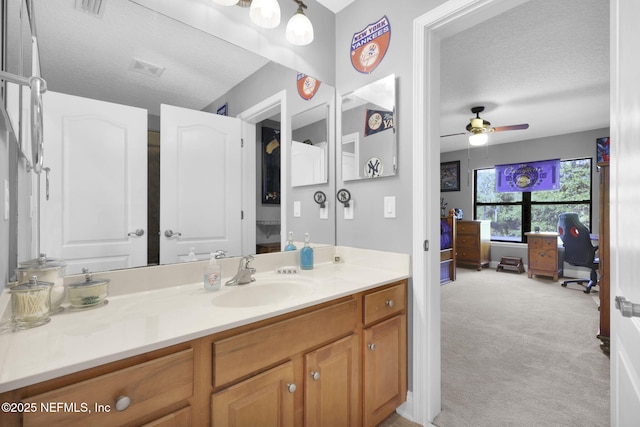 521 S Bridge Creek Dr, Saint Johns, FL 32259 - bathroom featuring a textured ceiling, ceiling fan, and vanity