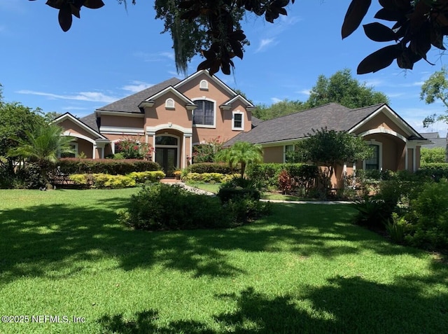521 S Bridge Creek Dr, Saint Johns, FL 32259 - view of front of house featuring stucco siding and a front yard