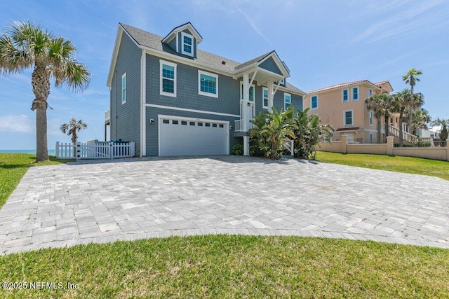 3083 S Ponte Vedra Blvd, Ponte Vedra Beach, FL 32082 - raised beach house featuring a garage and decorative driveway
