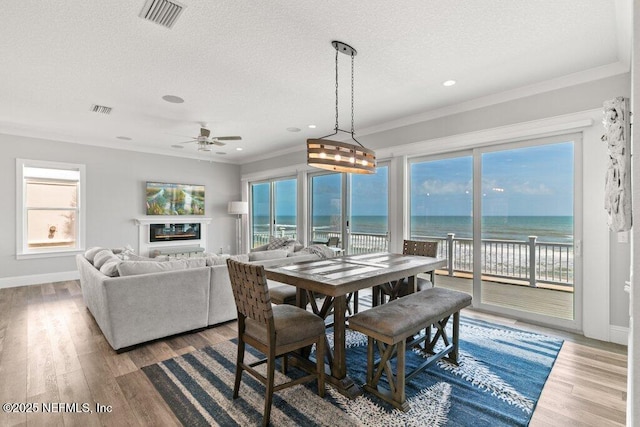 3083 S Ponte Vedra Blvd, Ponte Vedra Beach, FL 32082 - dining space with a textured ceiling, plenty of natural light, wood finished floors, crown molding, and recessed lighting