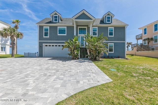 3083 S Ponte Vedra Blvd, Ponte Vedra Beach, FL 32082 - view of front of house featuring decorative driveway, an attached garage, and stairway